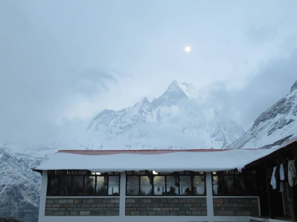 The moon out over Machhapuchare Mountain